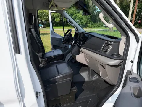 Driver cab with black front seats, steering wheel and dashboard