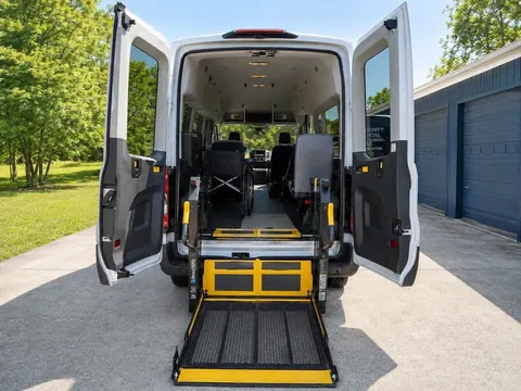 Rear doors open with a BraunAbility wheelchair lift platform lowered to the ground